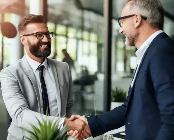 men closing deal shaking hands in a b2b SaaS Sales Cycle deal